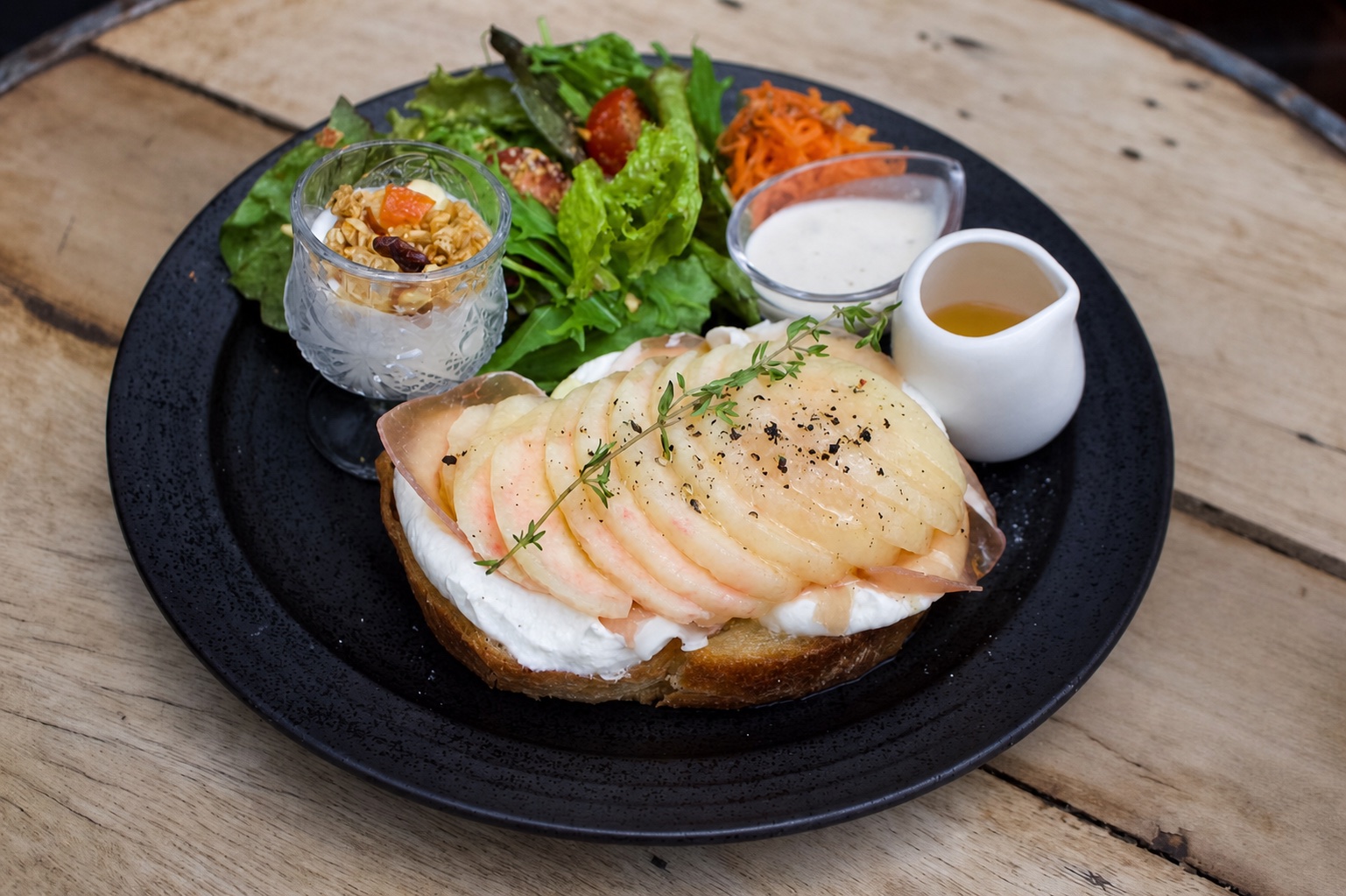 Peach and Greek yogurt open sandwich with salad